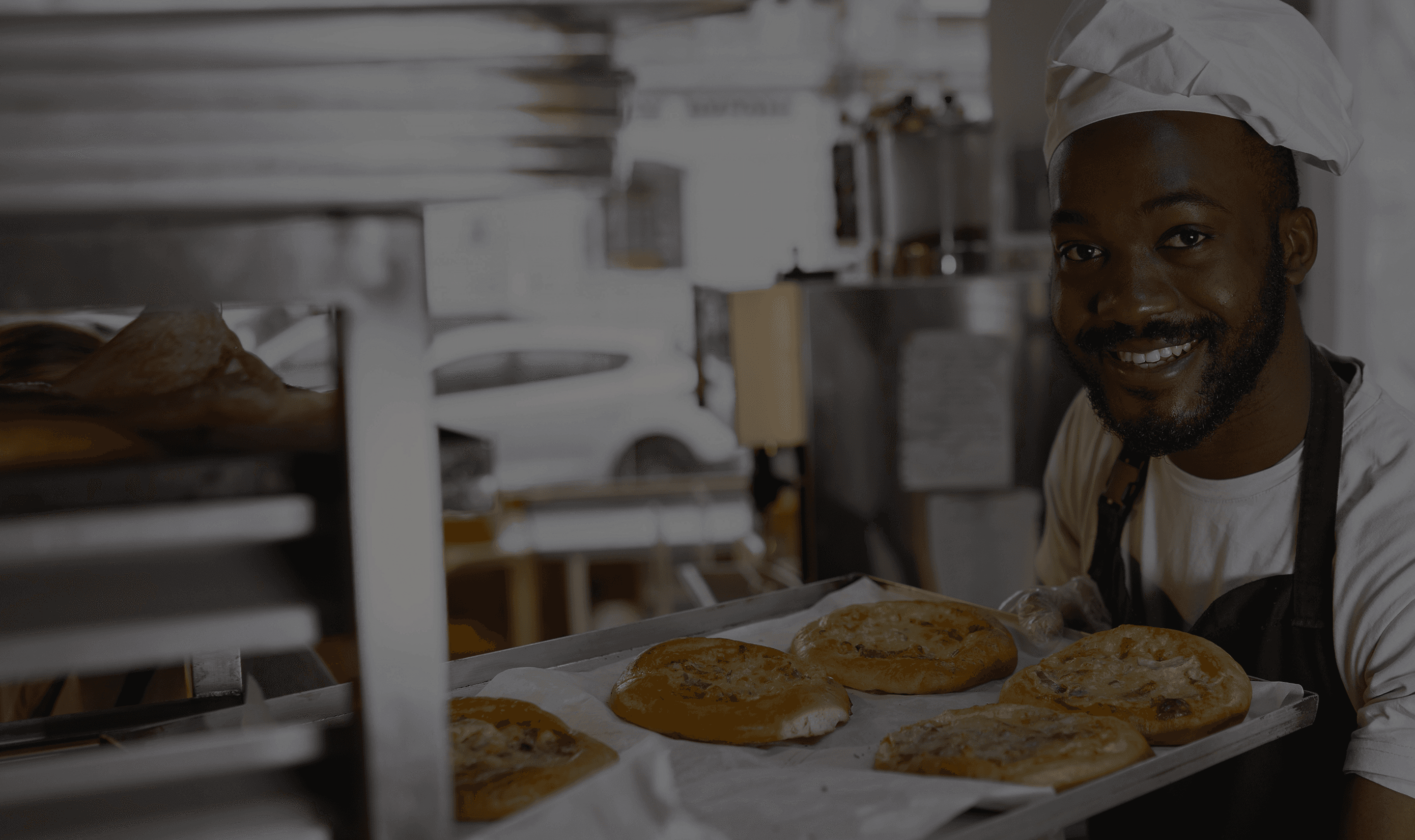 Smiling baker with bread