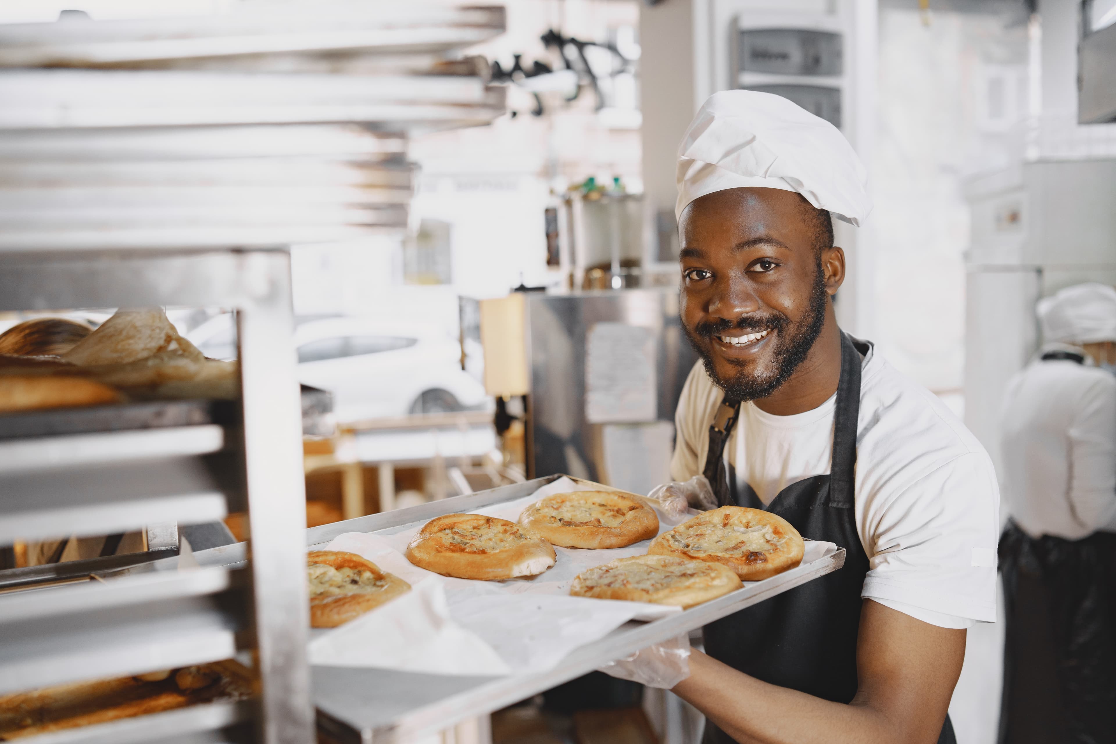 Smiling baker with bread